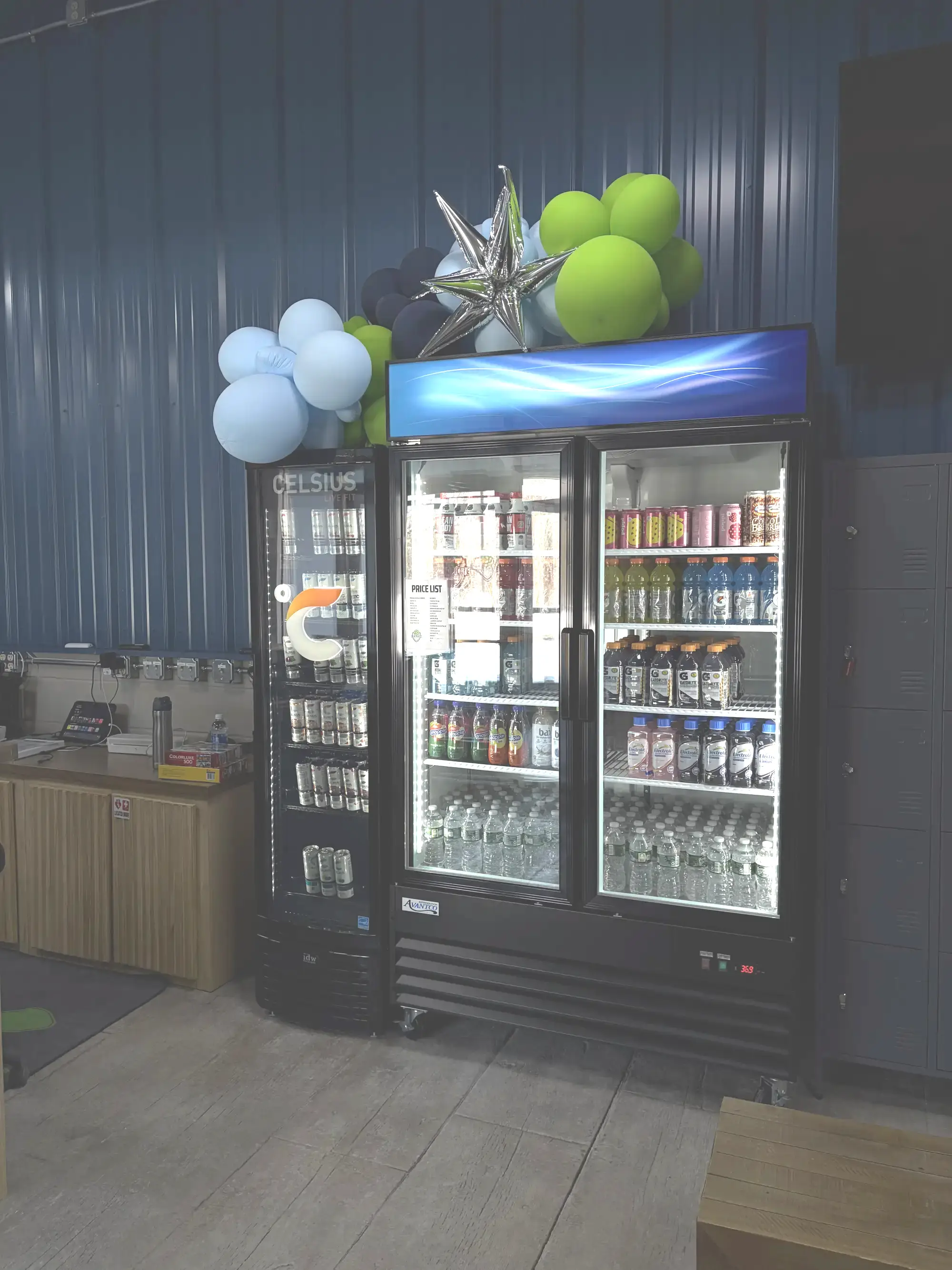 Beverage coolers stocked with beer, seltzers, water, and other drinks