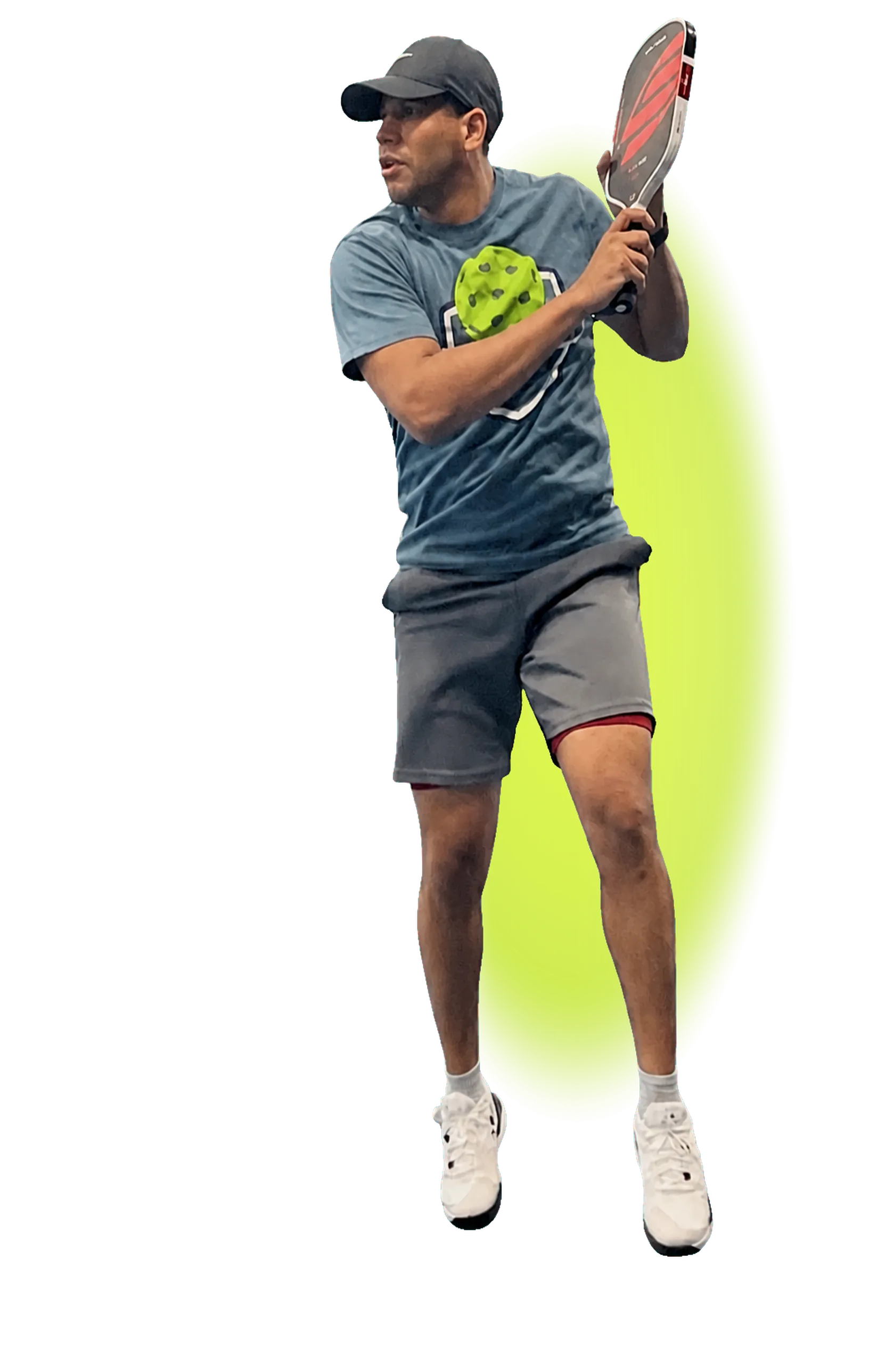 Pickleball player mid-swing