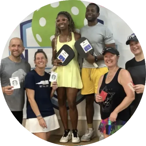Players holding gift cards and prizes after a club social